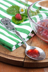 Silver spoon with strawberry jam