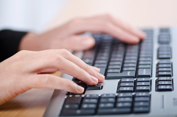 Hands typing on the keyboard