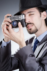 Fototapeta premium Photographer man with vintage camera