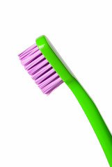 Colored toothbrush isolated on white background