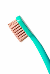 Colored toothbrush isolated on white background