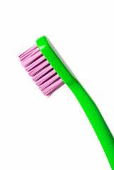 Colored toothbrush isolated on white background