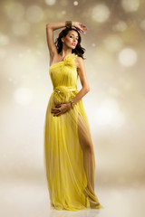 beautiful woman in yellow evening dress