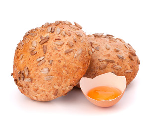 Bun with seeds and broken egg