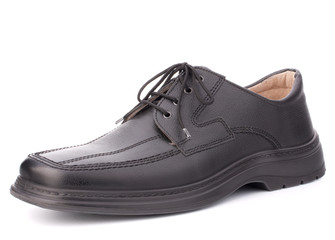 Black glossy man’s shoe with shoelaces