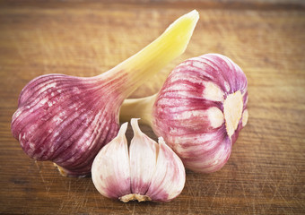 fresh garlic on an old wooden board