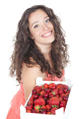 Beautiful young woman with strawberries and cherries