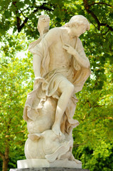 Old marble statue of allegory in Parc de Bruxelles