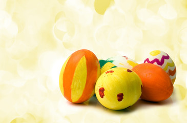 colored easter eggs on yellow