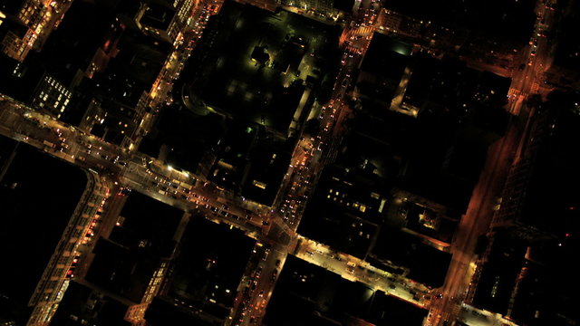 Aerial night vertical view of illuminated city skyscrapers, USA