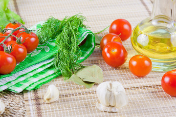 red ripe tomatoes with fresh greenery on a napkin