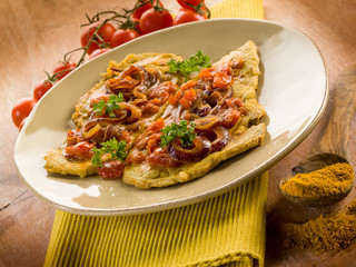 escalope with curry onions and tomatoes