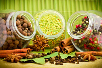 Pack of several spices and herbs in glass jars
