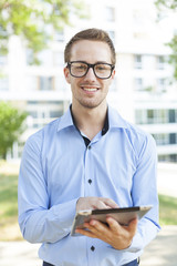 Businessman With Tablet Computer in park