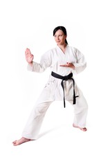 Karate woman posing on a white background