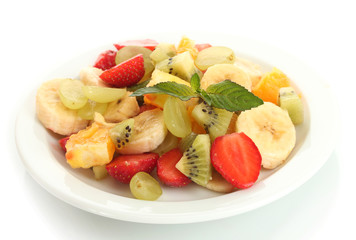 Fresh fruits salad on plate isolated on white
