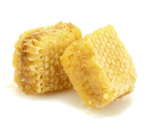 golden honeycombs isolated on white.