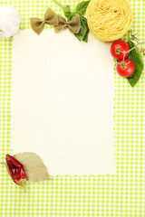 paper for recipes,vegetables and spices on green background