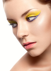 beautiful girl with a bright lemon-colored make-up