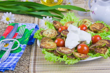 baked vegetable marrows with tomatoes and green sheet lettuce