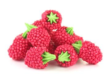 red candy raspberries isolated on white