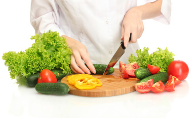 woman hands cutting vegetables on kitchen blackboard