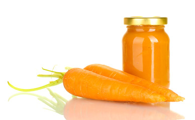 Jar with carrot baby food isolated on white
