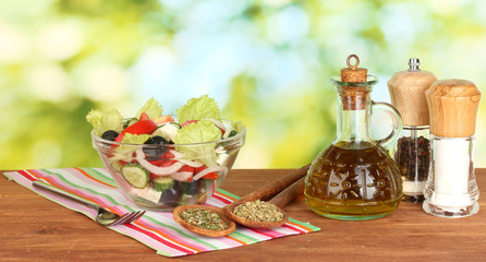 tasty greek salad on bright green background