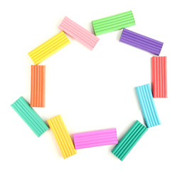 Children bright plasticine isolated on white