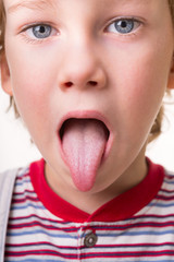 toddler shows tongue
