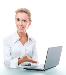 friendly administrative assistant at the desk with a laptop