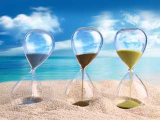 Three hourglass in the sand
