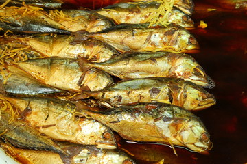 Mackerel fish in deep sauce boiling for Thai native food.