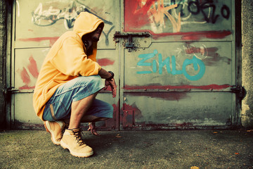 Young man portrait on graffiti grunge wall