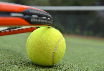 Tennis racquet and ball