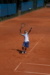 tennis player at the service