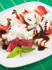 Crepes with strawberry and whipped cream