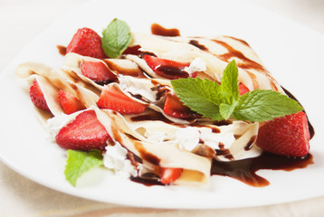 Crepes with strawberry and whipped cream