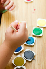 Little boy painting a picture