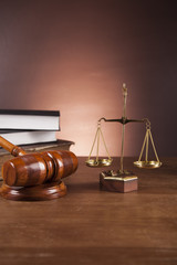 Law concept with wooden table and dark background