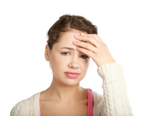 A young woman with a headache holding head