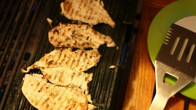 Grilling chicken breast on the barbecue