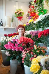Papier Peint photo Lavable Fleuriste woman in her small  flower shop