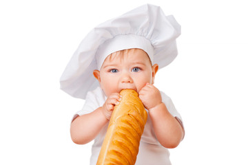 Little boy in a cap and with bread