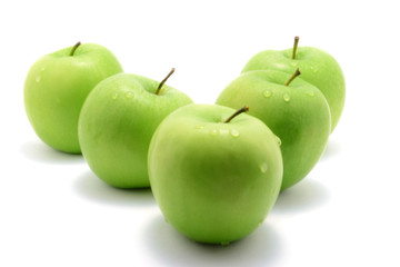 Five green apples isolated over white