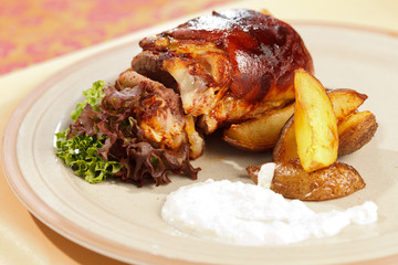 roasted pork knuckle with potatoes