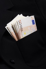 Pile of money fifty euros banknotes in pocket