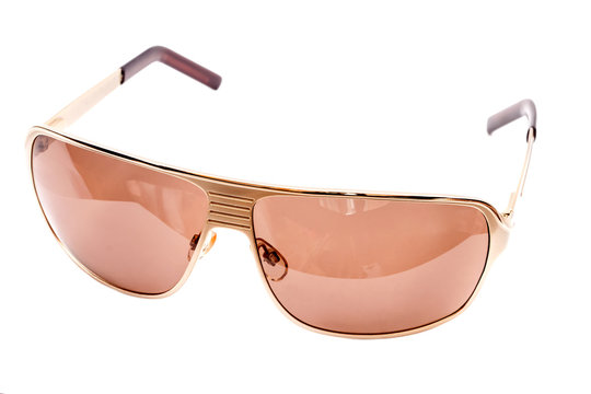 Gold Sunglasses On A White Background.