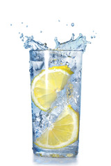 Fototapeta na wymiar two lemons fell in a glass