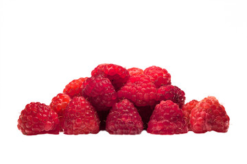 Raspberry lie a handful on a flat white surface